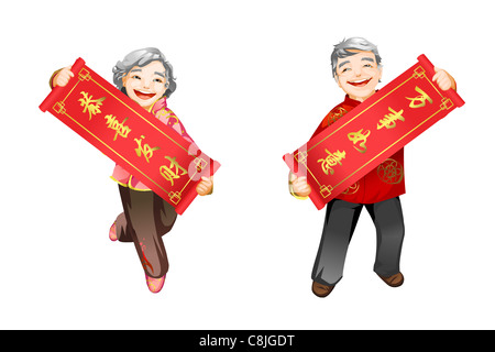 Senior couple holding couplets du Nouvel An chinois Banque D'Images