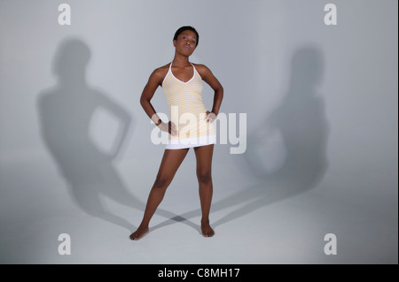 Mixed Race woman standing with hands on hips Banque D'Images