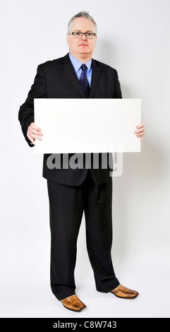 Business man holding un sandwich board Banque D'Images