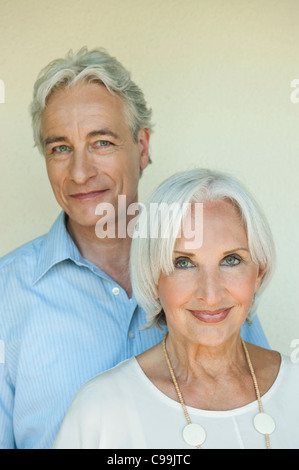 Germany, Bavaria, Mature man and woman against white background, Close up, smiling, portrait Banque D'Images