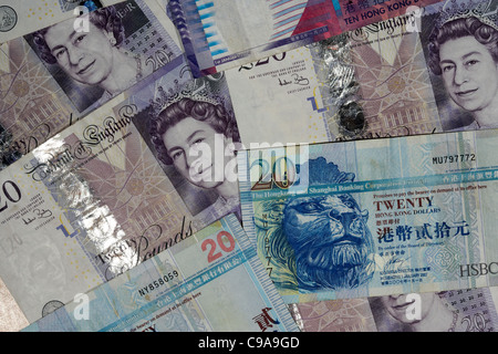Les livres sterling et en dollars de hong kong billets Banque D'Images