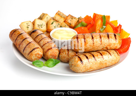 Saucisses de poulet avec pommes de terre SAUTE Banque D'Images