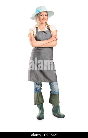 Portrait of a smiling female farmer avec ses mains croisées Banque D'Images