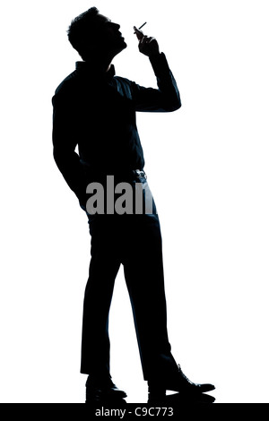 Un homme de race blanche pleine longueur cigarette silhouette en studio isolé sur fond blanc Banque D'Images