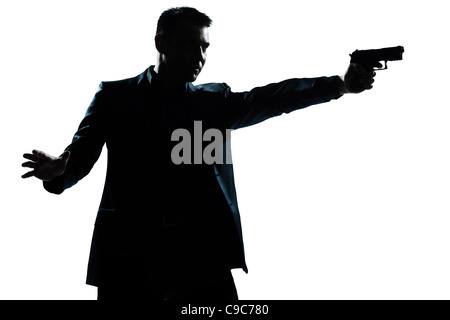 Un caucasian man with gun portrait silhouette en studio vue isolé sur fond blanc Banque D'Images