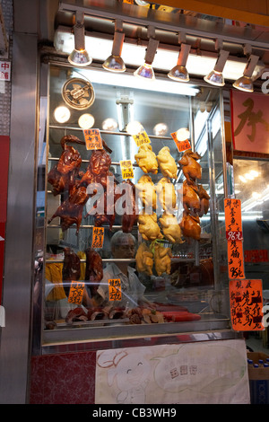Siu mei les viandes rôties accroché dans la fenêtre d'un restaurant chinois de l'île de Hong Kong région administrative spéciale de Chine Banque D'Images