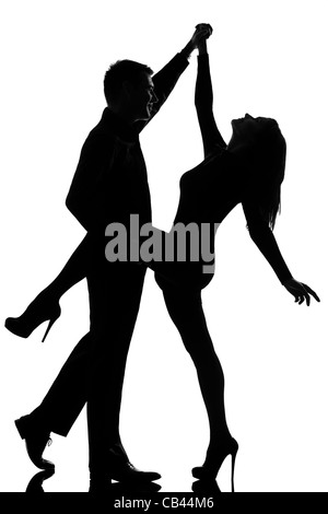 Un couple homme et femme dansant rock en silhouette studio isolé sur fond blanc Banque D'Images