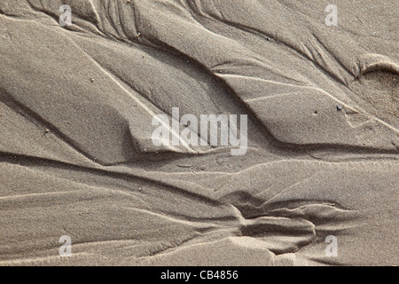 Motifs dans le sable à Weston Super Mare, Somerset, Angleterre, Royaume-Uni Banque D'Images