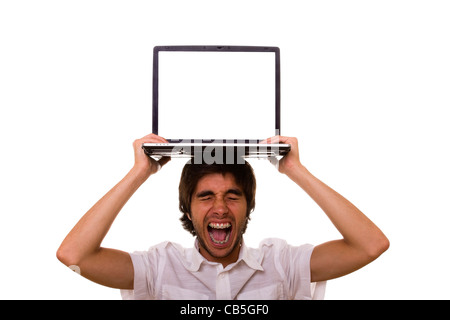 Jeune homme a souligné avec un ordinateur portable sur la tête Banque D'Images