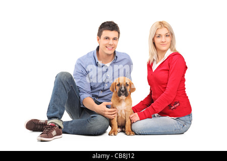 Couple avec un chiot cane corso Banque D'Images