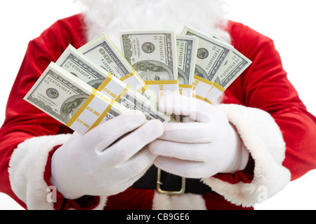 Close-up of Santa's hands avec des piles de billets en dollars Banque D'Images