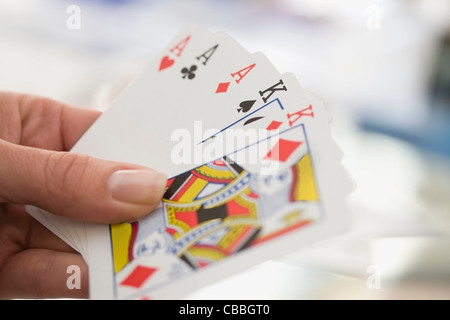 Close up of woman playing cards Banque D'Images