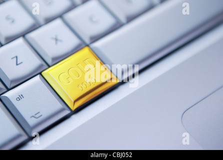 Acheter Gold Online. Image conceptuelle du clavier avec une touche représentée par une barre dorée Banque D'Images