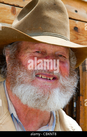 Muleskinner équitation sur un chariot couvert dans la ville de rochers Réserve Nationale et State Park dans le comté de Cassia, Florida, USA. M. Banque D'Images