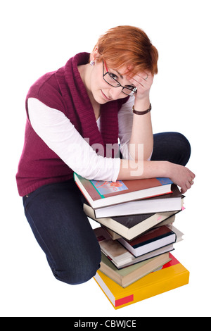 Fille étudiante avec de nombreux livres isolé sur fond blanc Banque D'Images