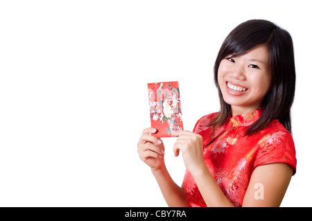 Happy girl oriental cheongsam de vous souhaiter une bonne nouvelle année chinoise. Banque D'Images