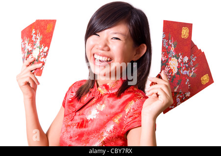 Happy girl oriental cheongsam de vous souhaiter une bonne nouvelle année chinoise. Banque D'Images