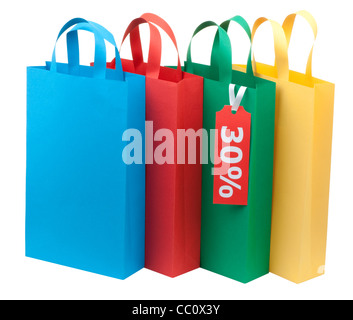 Quatre sacs colorés pour le shopping avec sale tag Banque D'Images
