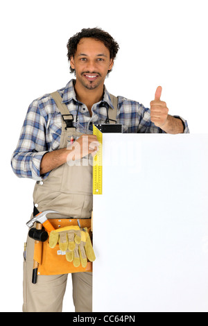 Builder se leva avec panneau publicitaire vide Banque D'Images
