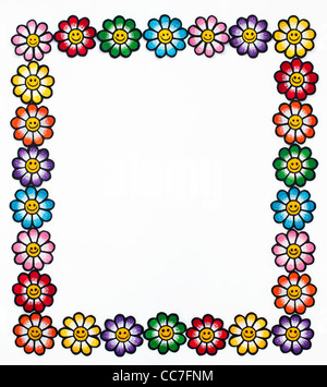 Fer à repasser la broderie sur les correctifs de smiley fleurs multicolores dans un cadre sur un fond blanc Banque D'Images