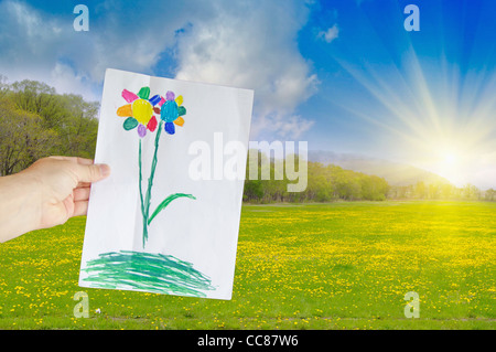 Côté est titulaire d'un dessin d'enfant fleur sur l'arrière-plan de prairie jaune Banque D'Images
