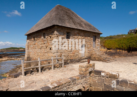 Le Moulin de Berlot, un ancien moulin à marée sur l'île de Bréhat, au large des côtes de Bretagne, France. Banque D'Images