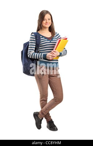 Portrait of a smiling school girl posing avec ses livres Banque D'Images