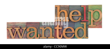 Help Wanted mots en typographie vintage wooden blocks, tachés par les encres de couleur, isolated on white Banque D'Images