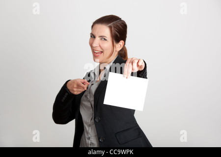 Beautiful business woman holding a blank card Banque D'Images