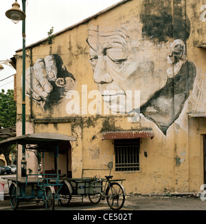 Peinture murale à George Town dans l'île de Penang en Malaisie en Extrême-Orient Asie du sud-est. Street Art Graffiti urbain Voyage interne Banque D'Images