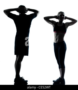 Un homme femme couple exercising workout posture physique aérobie silhouette pleine longueur sur studio isolé sur fond blanc Banque D'Images