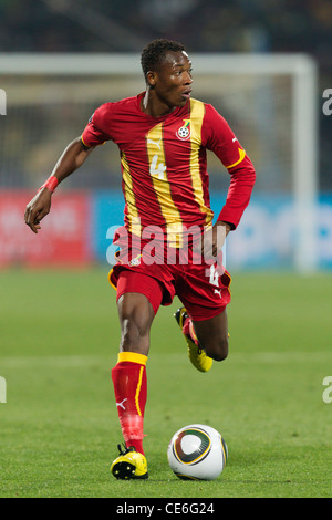 John Pantsil du Ghana s'exécute avec la balle pendant la Coupe du Monde de la série de 16 match contre les États-Unis au Royal Bafokeng Banque D'Images