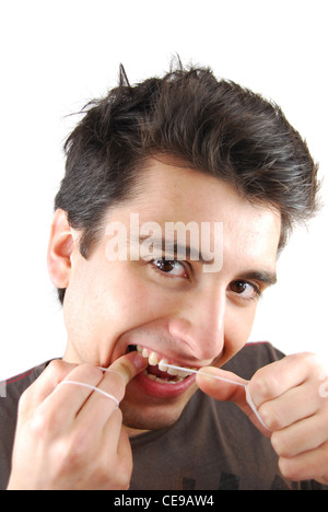 L'homme de la soie dentaire Les dents Banque D'Images