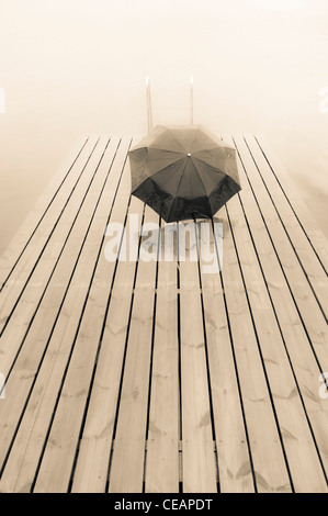 Parapluie sur jetty Banque D'Images