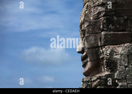 Stone face à Avalokiteshvara, temple Bayon Banque D'Images