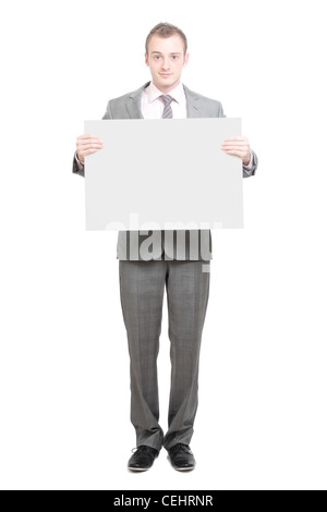 Un business man holding an empty sign Banque D'Images
