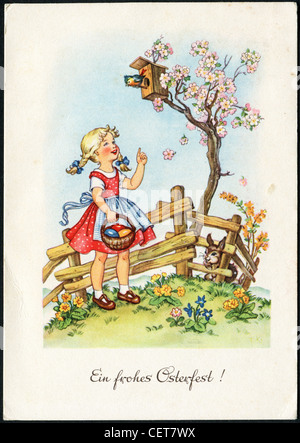 Carte postale de pâques imprimé en Autriche, montrent une petite fille avec un panier, lapin, fleur, vers 1954. Texte allemand : Joyeuses Pâques ! Banque D'Images