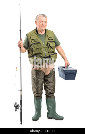 Full Length portrait of a young fisherman holding un équipement de pêche isolé sur fond blanc Banque D'Images