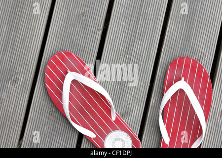 Tongs sur le plancher Banque D'Images