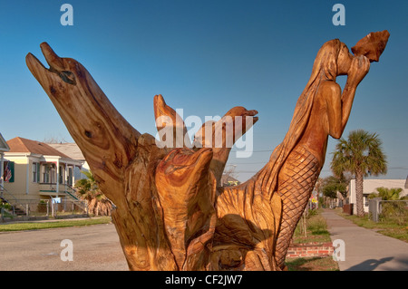 Les dauphins et sirène, sculpté de Live Oak tree détruites par les inondations causées par l'ouragan Ike de Galveston, Texas, États-Unis Banque D'Images