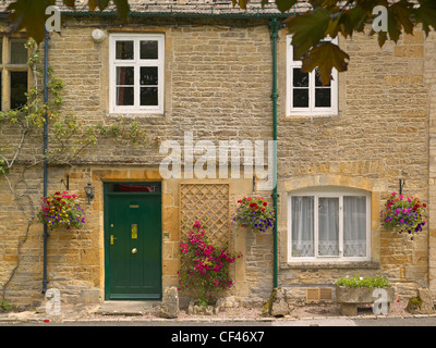 Vue extérieure de la couleur miel cottages en Stow on the Wold. Banque D'Images