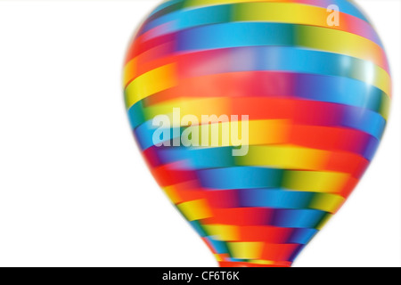 Montgolfière multicolores tourbillonnant jouet isolé sur fond blanc Banque D'Images