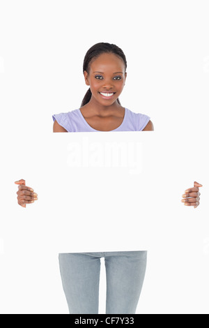 Close up of woman presenting placeholder sur fond blanc Banque D'Images