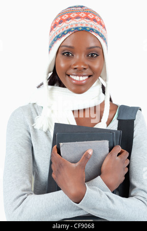 Close up of woman avec des vêtements d'hiver et des livres Banque D'Images