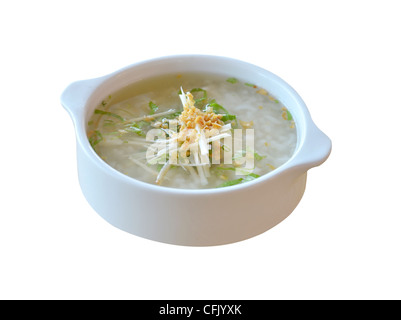 Soupe de riz de style asiatique avec des herbes dans un bol Banque D'Images