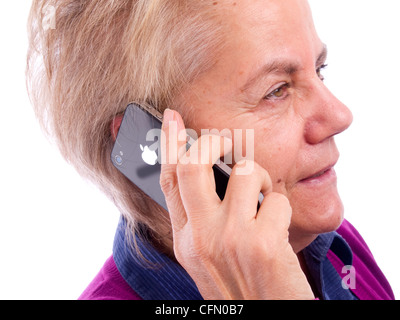 Close up of young woman talking on iPhone Banque D'Images