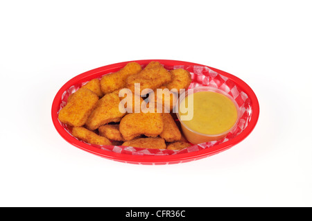 Nuggets de poulet avec sauce à la moutarde au miel panier en plastique Banque D'Images