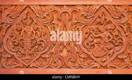 Ancienne sculpture en bois dans un style thaï Banque D'Images