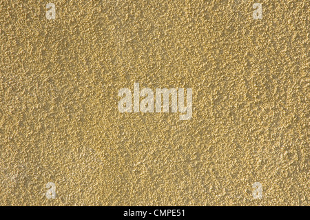 La texture du mur de mortier jaune ou d'arrière-plan Banque D'Images