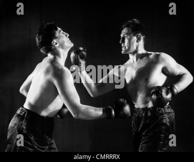 1930 L'HOMME DANS LE MATCH DE BOXE AVEC LUI-MÊME Banque D'Images